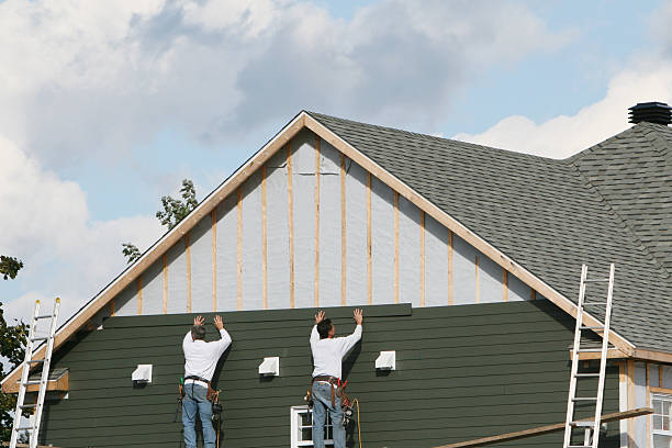 Professional Storm Damage Siding Repair technician working in Inverness, FL